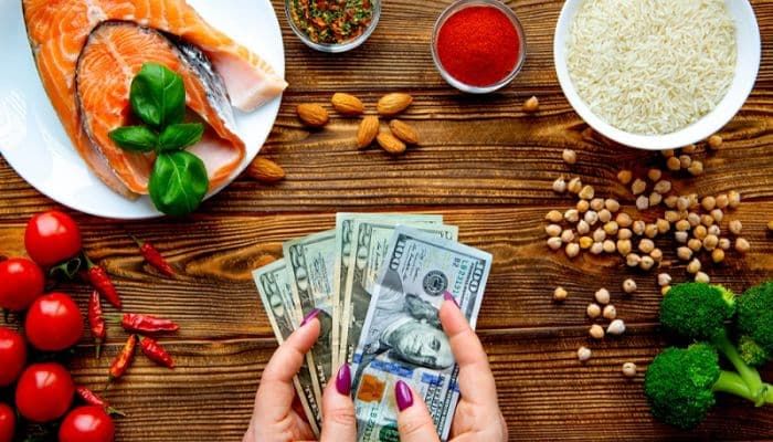 Food items with a man counting money